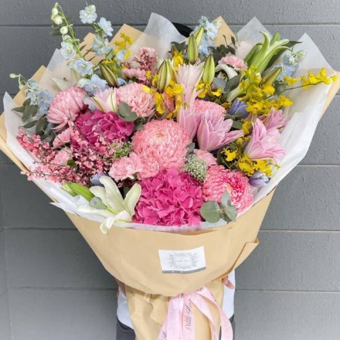 Double Petaled Lily And Delphinium Bouquet